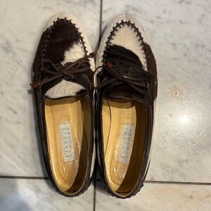 Barneys New York Brown and White cowhide loafers.